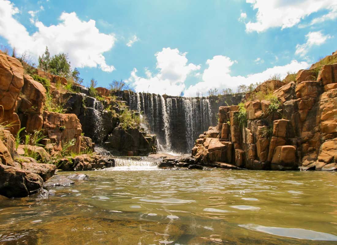 Below the waterfall