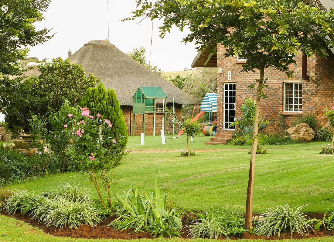 Open lawns and thatched buildings